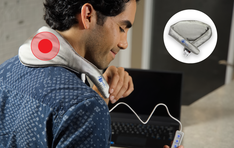 Woman sits at desk with a support cushion